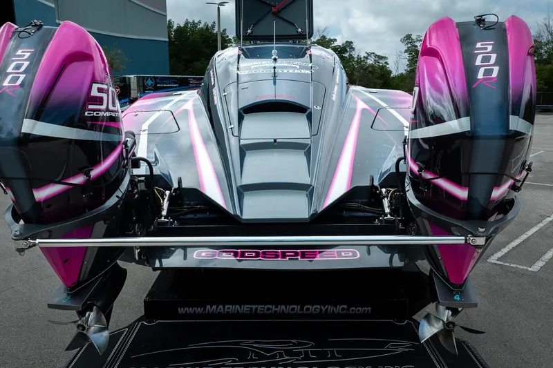  Yacht Photos Pics 2023 MTI 390XR powerboat with dual 500R engines, featuring sleek pink and gray design.