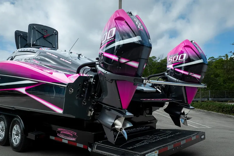  Yacht Photos Pics 2023 MTI 390XR boat with vibrant pink and black design, featuring dual 500 competition engines.