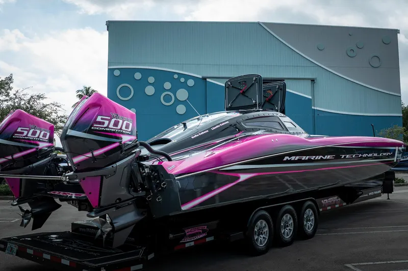  Yacht Photos Pics 2023 MTI 390XR powerboat with vibrant pink accents and twin 500 competition engines.