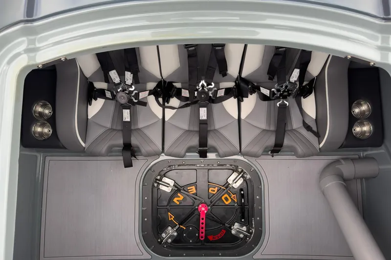  Yacht Photos Pics Interior of 2023 MTI 390XR boat with harnessed seats and control panel.