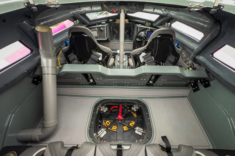  Yacht Photos Pics Interior of a 2023 MTI 390XR boat, featuring advanced seating and control systems.