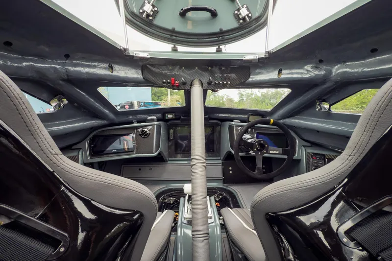  Yacht Photos Pics Interior of 2023 MTI 390XR, showcasing advanced cockpit design and steering wheel.