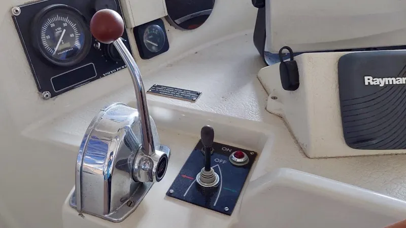 Forever Young Yacht Photos Pics Control panel of a 2000 Amel Super Maramu yacht with throttle and navigation instruments.