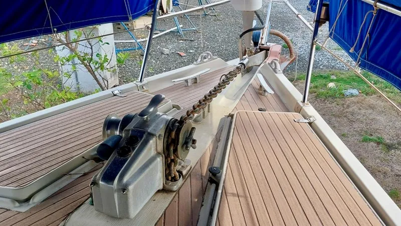 Forever Young Yacht Photos Pics Deck view of 2000 Amel Super Maramu sailboat with anchor chain and winch.