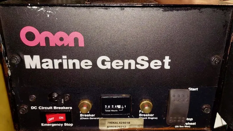 Forever Young Yacht Photos Pics Onan Marine GenSet control panel on Amel Super Maramu 2000 yacht.