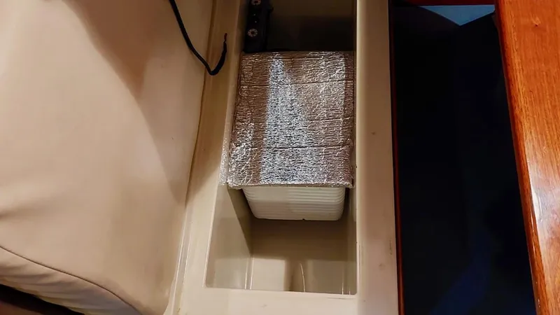 Forever Young Yacht Photos Pics Storage compartment in Amel Super Maramu 2000 yacht, featuring insulated container.