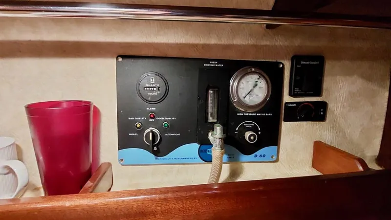 Forever Young Yacht Photos Pics Control panel of a 2000 Amel Super Maramu yacht with gauges and switches.