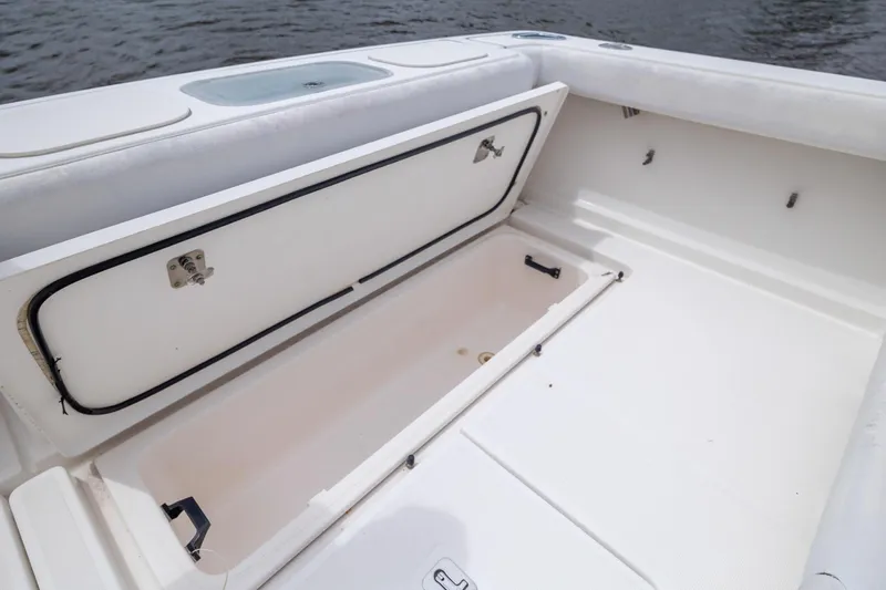 Knot On Call Yacht Photos Pics 2004 Tiara Yachts 3200 Open storage compartment on deck, near water.