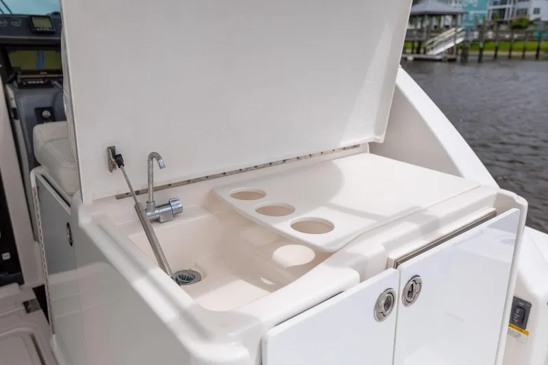 Knot On Call Yacht Photos Pics 2004 Tiara Yachts 3200 Open boat sink and storage area by the water.