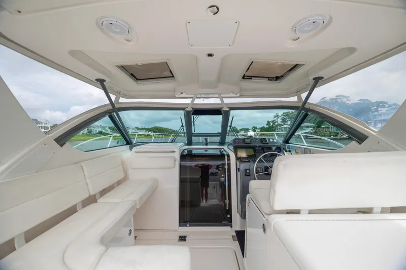 Knot On Call Yacht Photos Pics Interior of 2004 Tiara Yachts 3200 Open, featuring helm and seating area.