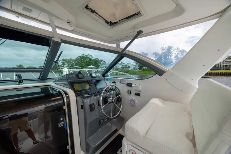 Knot On Call Yacht Photos Pics 2004 Tiara Yachts 3200 Open helm with modern controls and comfortable seating.