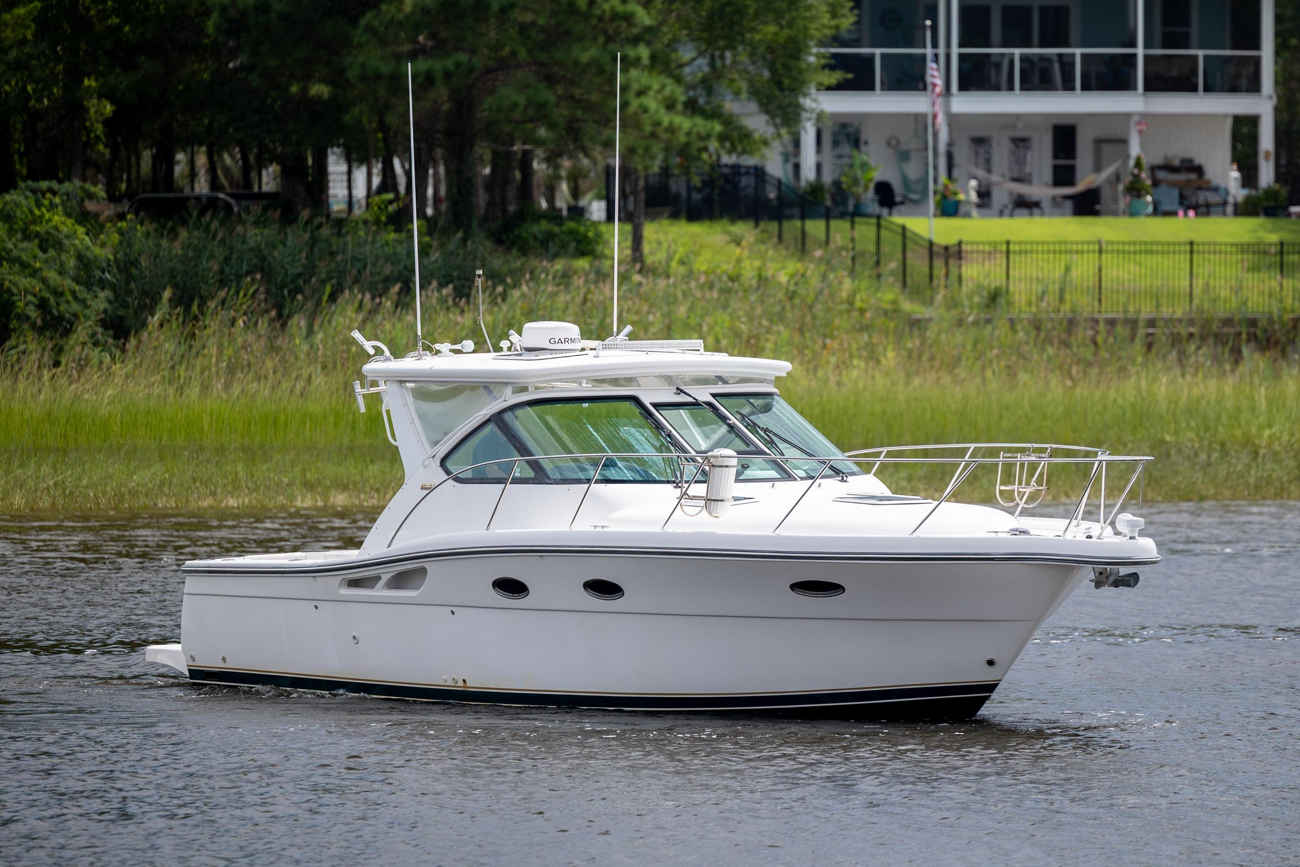 2004 Tiara Yachts 3200 Open cruising on a serene waterway.