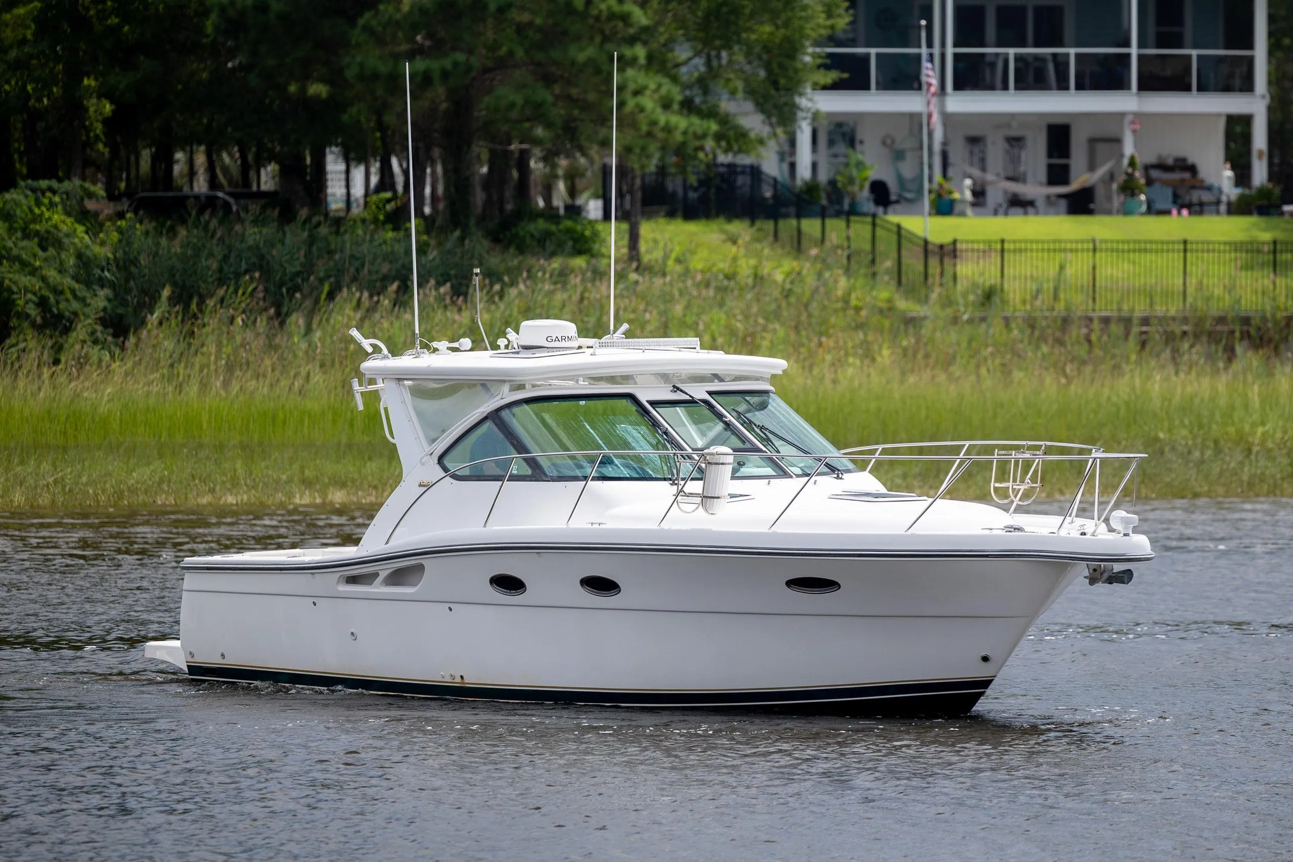 2004 Tiara Yachts 3200 Open cruising on a serene waterway.