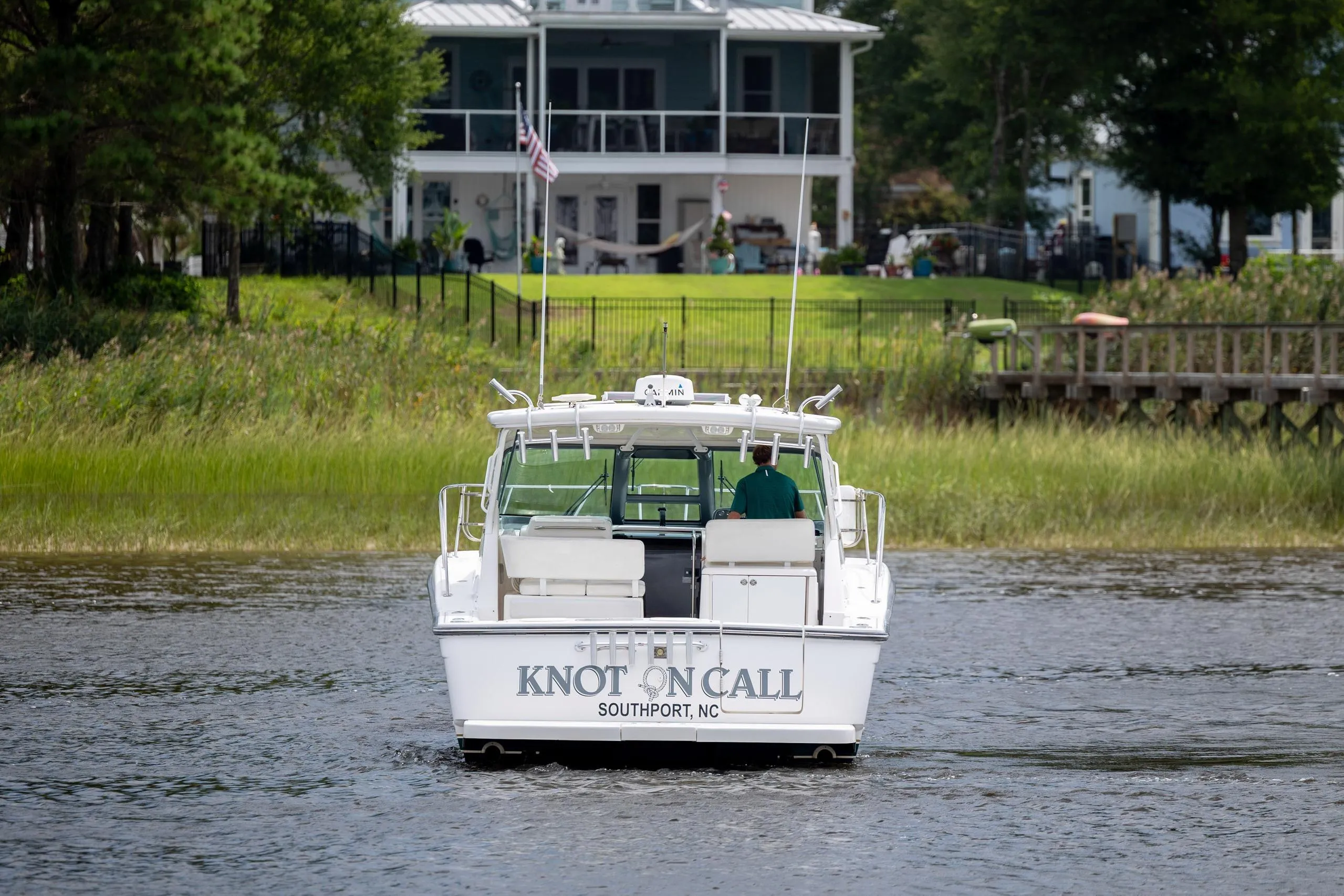 2004 Tiara Yachts 3200 Open boat named "Knot on Call" on a serene waterway.