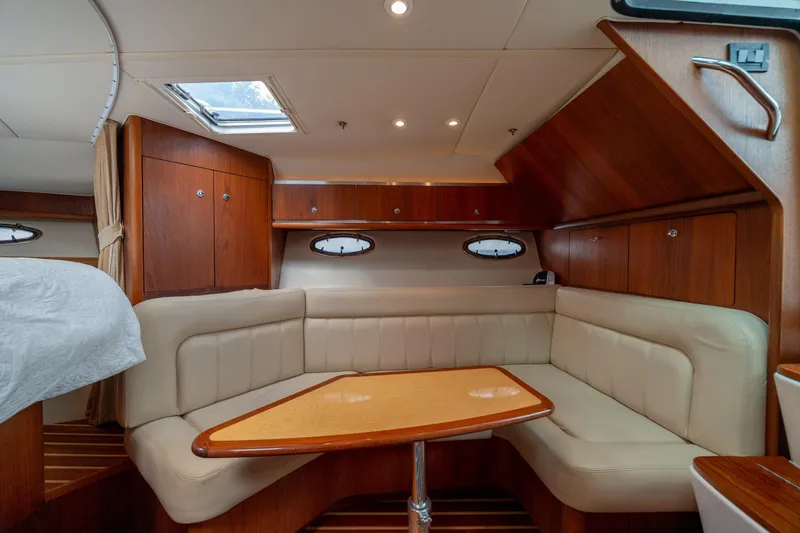 Knot On Call Yacht Photos Pics Luxurious interior of 2004 Tiara Yachts 3200 Open with elegant wood and leather seating.