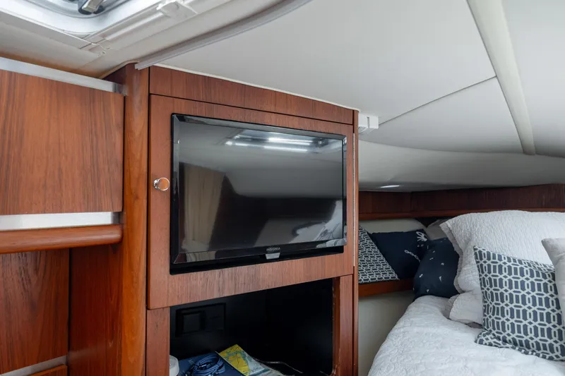 Knot On Call Yacht Photos Pics 2004 Tiara Yachts 3200 Open cabin with TV and cozy bedding.