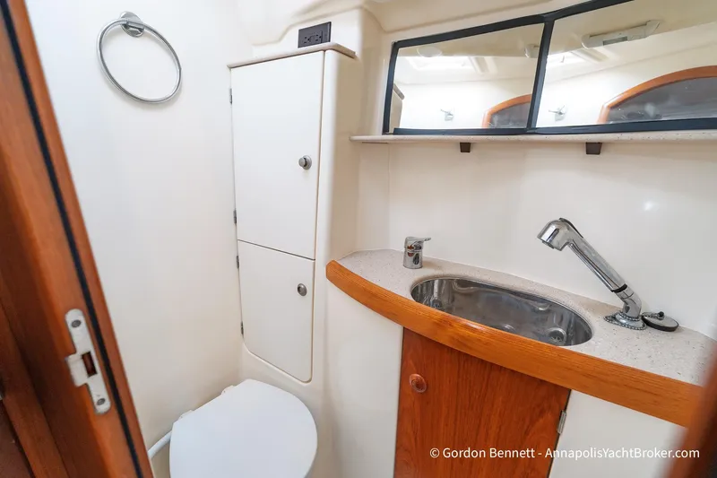 Margaritaville Yacht Photos Pics Bathroom of 2004 Jeanneau Sun Odyssey 43 DS yacht with sink and storage.