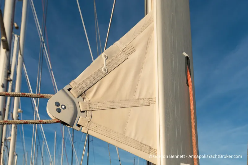 Margaritaville Yacht Photos Pics Close-up of Jeanneau Sun Odyssey 43 DS sail rigging, 2004 model, against clear blue sky.