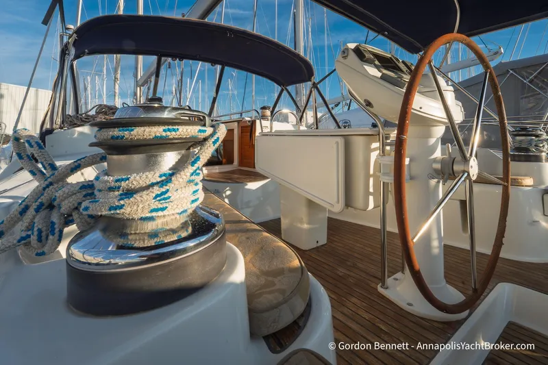 Margaritaville Yacht Photos Pics 2004 Jeanneau Sun Odyssey 43 DS yacht cockpit with steering wheel and winch.