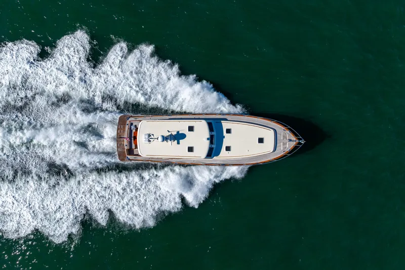 Holly Ann Yacht Photos Pics Aerial view of 2010 Vicem 64 Classic yacht cruising on open water.