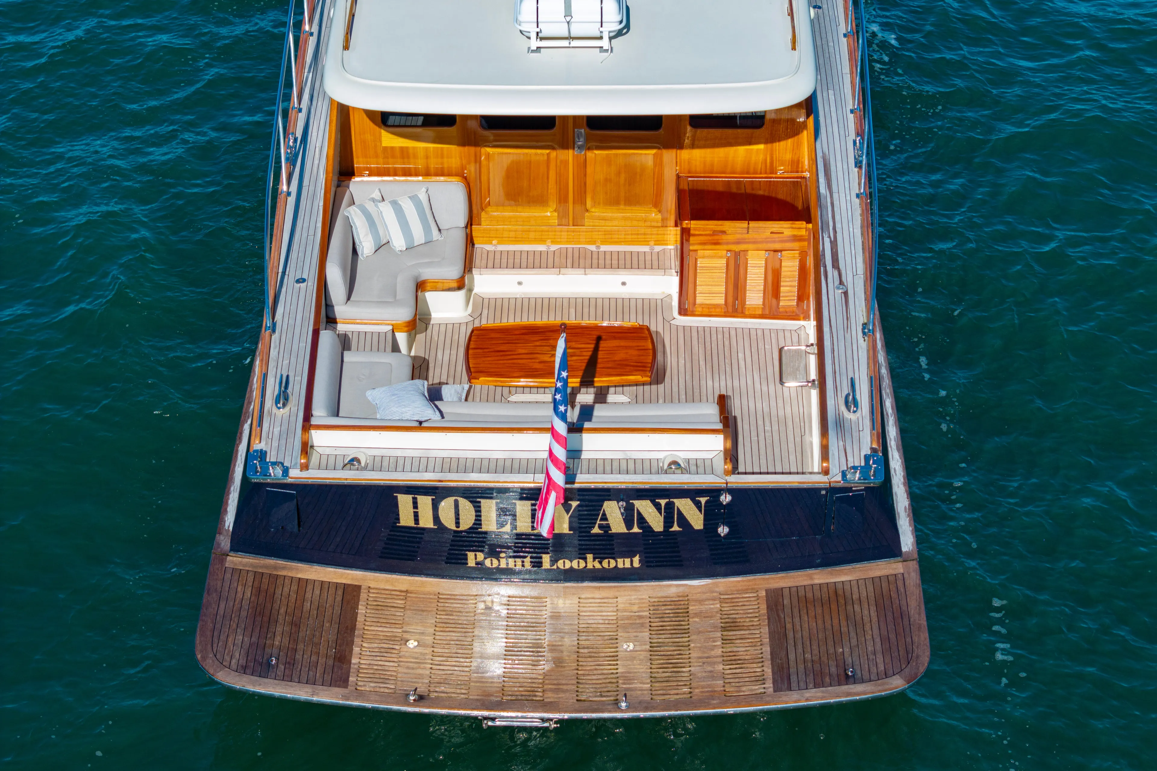 Holly Ann Yacht Photos Pics 2010 Vicem 64 Classic yacht with elegant deck and seating, named "Holly Ann," on the water.