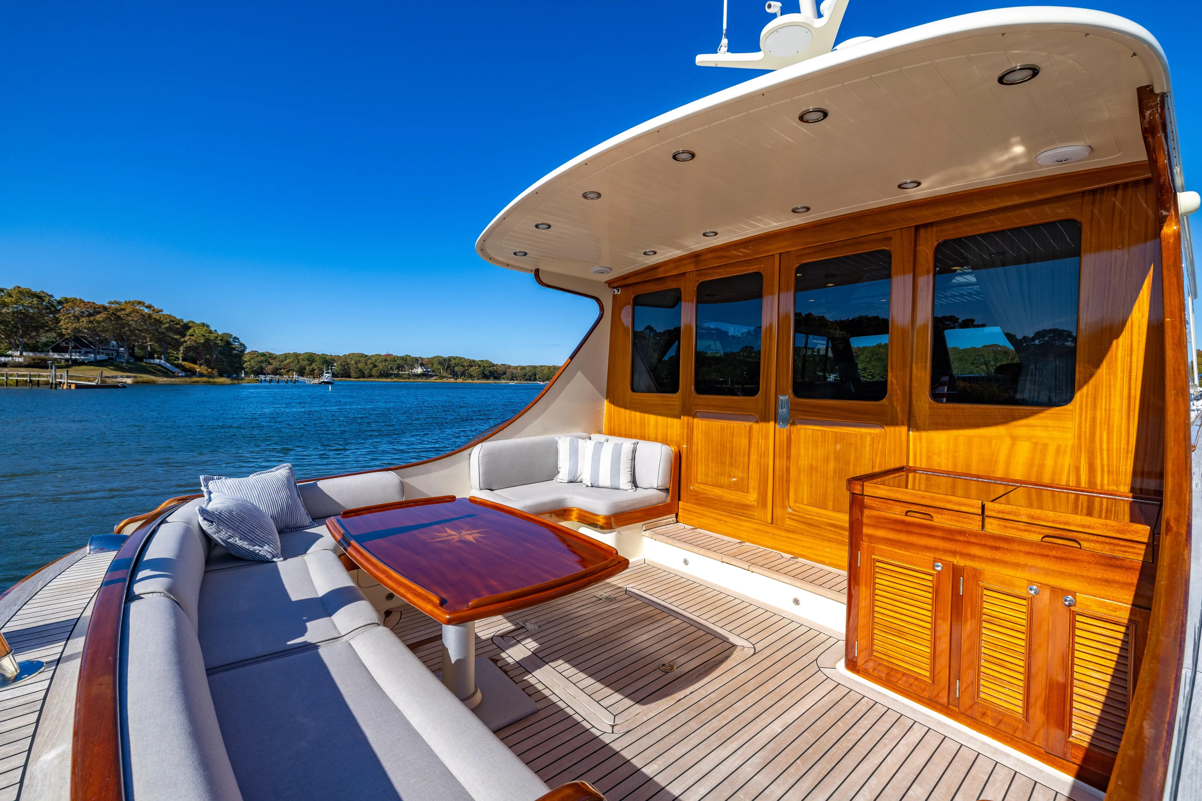 Holly Ann Yacht Photos Pics Luxurious 2010 Vicem 64 Classic yacht deck with elegant wood finish and scenic water view.