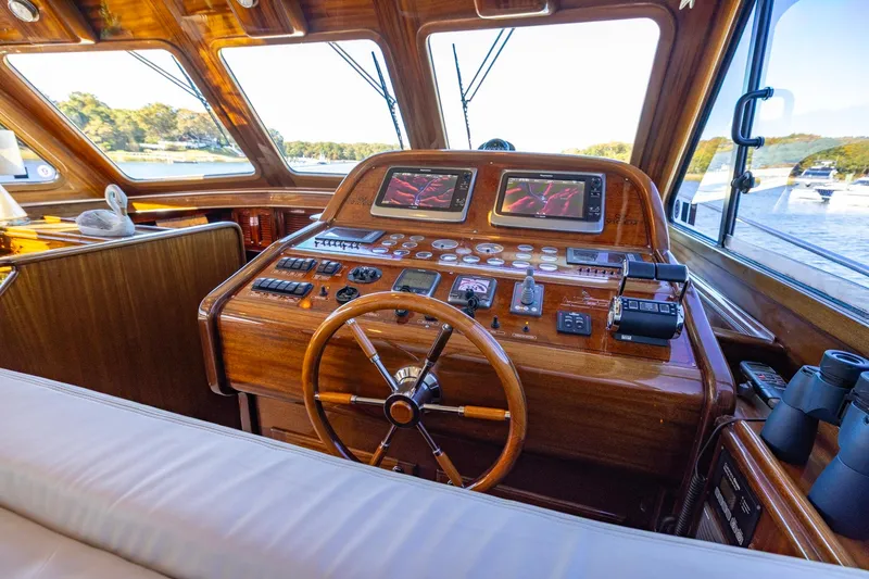 Holly Ann Yacht Photos Pics Cockpit of 2010 Vicem 64 Classic yacht with wooden helm and navigation instruments.