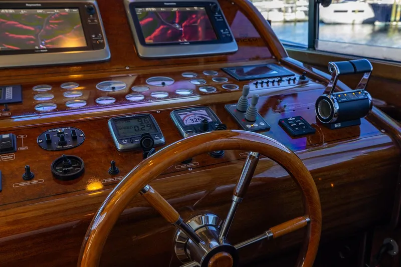 Holly Ann Yacht Photos Pics Vicem 64 Classic 2010 yacht helm with wooden steering wheel and navigation controls.