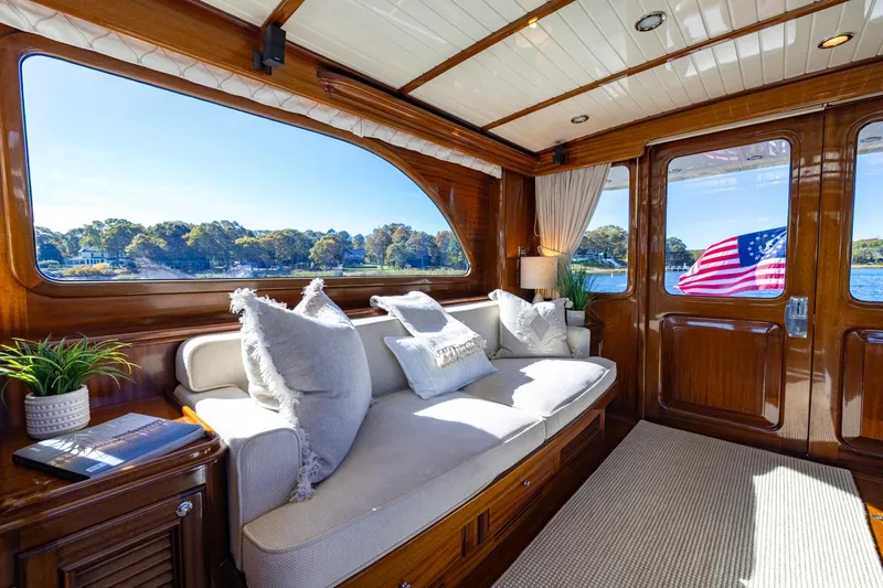 Holly Ann Yacht Photos Pics Luxurious interior of 2010 Vicem 64 Classic yacht with elegant wood finish and scenic views.