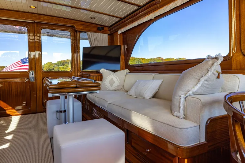 Holly Ann Yacht Photos Pics Luxurious interior of 2010 Vicem 64 Classic yacht with plush seating and elegant wood finishes.