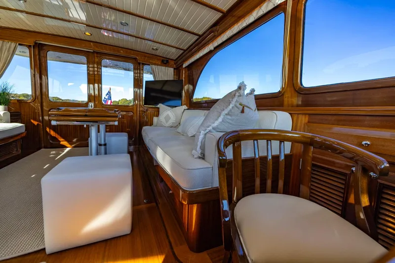 Holly Ann Yacht Photos Pics Luxurious interior of 2010 Vicem 64 Classic yacht with elegant wood finish and plush seating.