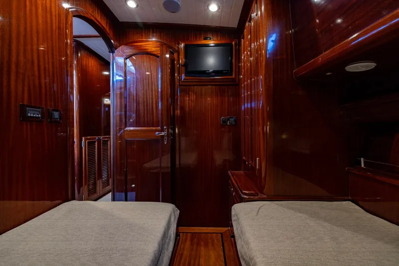 Holly Ann Yacht Photos Pics Luxurious 2010 Vicem 64 Classic yacht interior with rich wood finish and twin beds.