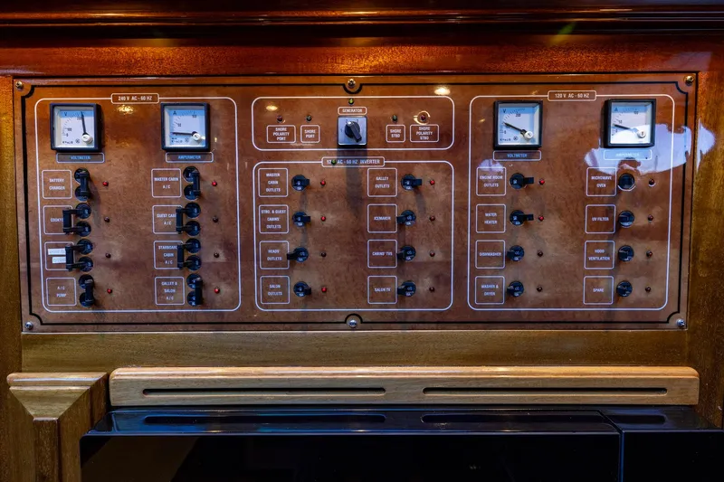 Holly Ann Yacht Photos Pics Control panel of a 2010 Vicem 64 Classic yacht, featuring voltmeters and switches.