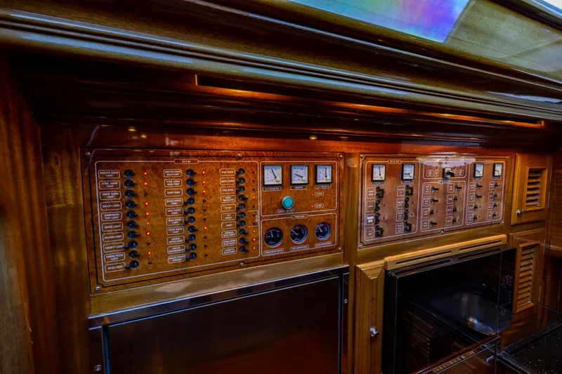 Holly Ann Yacht Photos Pics Control panel of 2010 Vicem 64 Classic yacht with wood finish and gauges.
