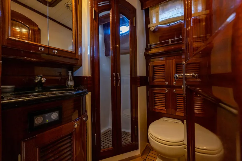 Holly Ann Yacht Photos Pics Luxurious 2010 Vicem 64 Classic yacht bathroom with elegant wood finishes and modern amenities.