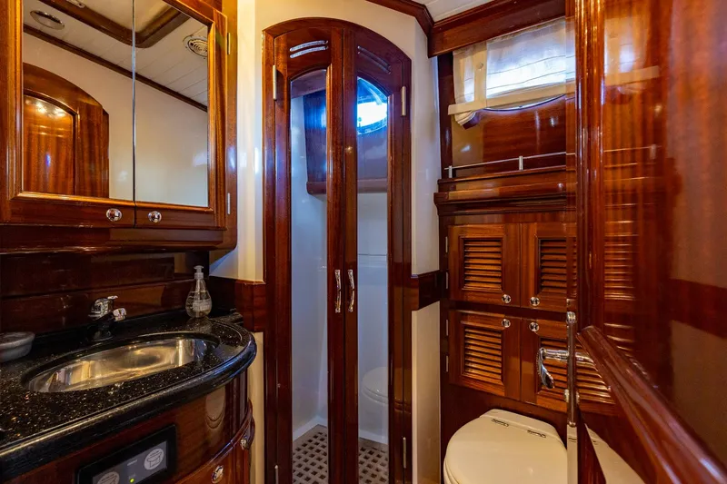 Holly Ann Yacht Photos Pics Luxurious 2010 Vicem 64 Classic yacht bathroom with elegant wood finishes and modern amenities.