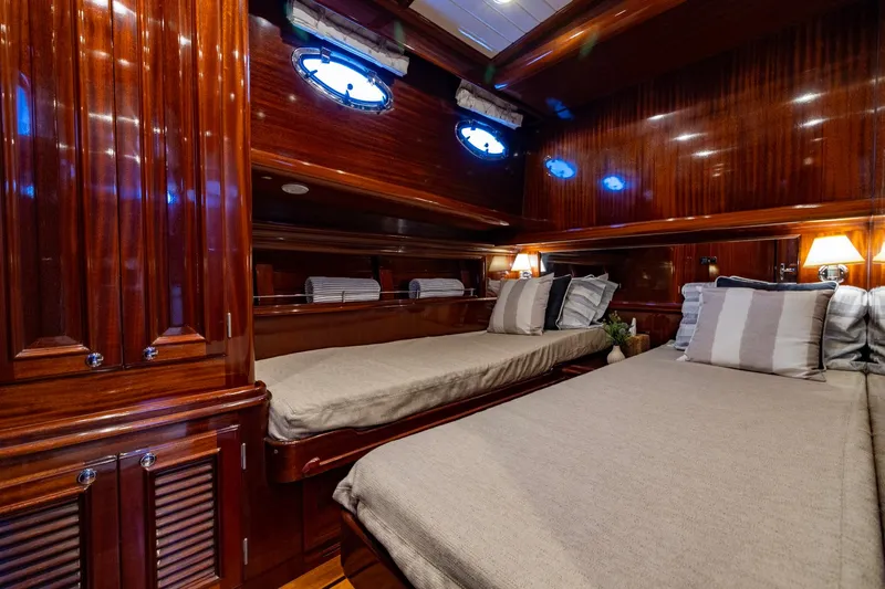 Holly Ann Yacht Photos Pics Luxurious 2010 Vicem 64 Classic yacht cabin with elegant wood finish and cozy twin beds.