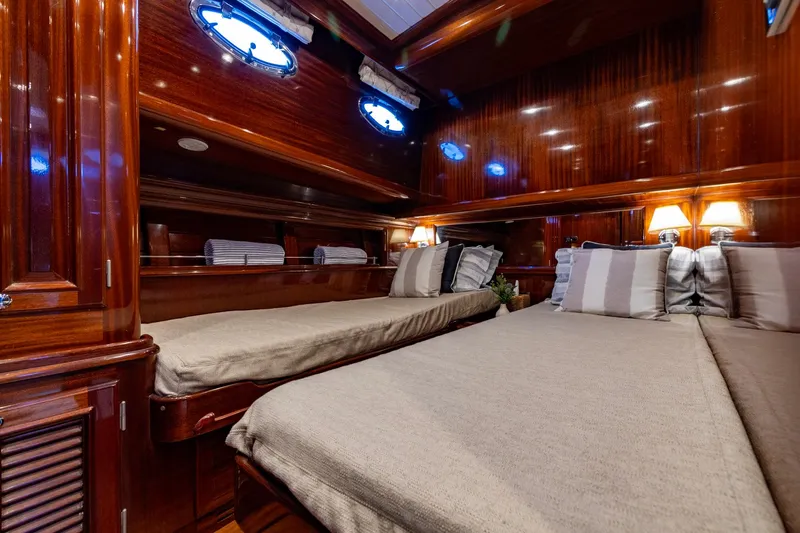 Holly Ann Yacht Photos Pics Luxurious 2010 Vicem 64 Classic yacht cabin with elegant wood finish and cozy bedding.