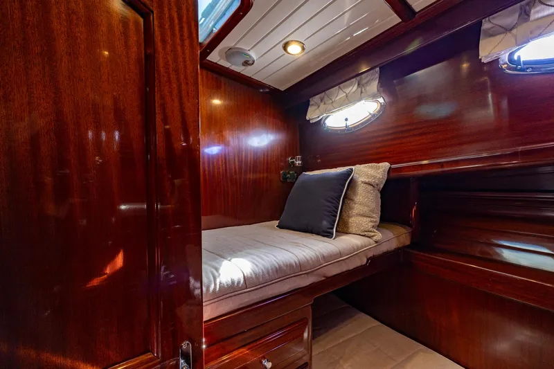 Holly Ann Yacht Photos Pics Luxurious cabin interior of 2010 Vicem 64 Classic yacht with rich wood finish.