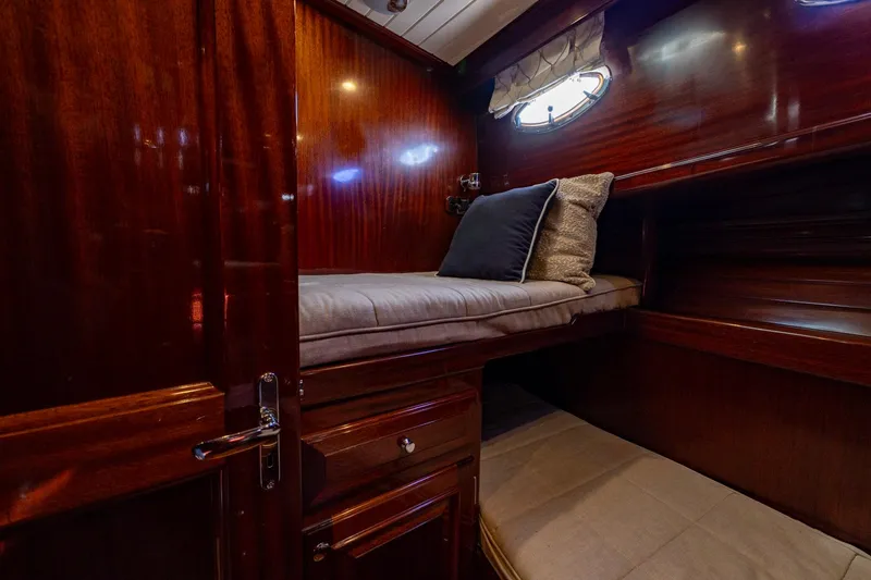 Holly Ann Yacht Photos Pics Luxurious wooden cabin interior of 2010 Vicem 64 Classic yacht with cozy bunk beds.