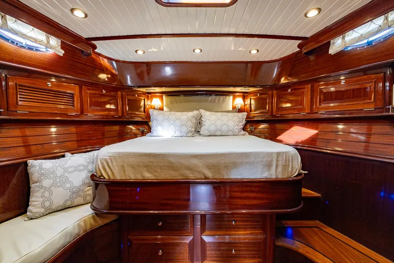 Holly Ann Yacht Photos Pics Luxurious 2010 Vicem 64 Classic yacht cabin with elegant wood finish and cozy bedding.