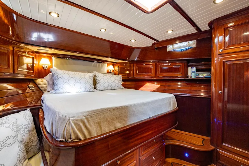 Holly Ann Yacht Photos Pics Luxurious 2010 Vicem 64 Classic yacht bedroom with polished wood and elegant bedding.