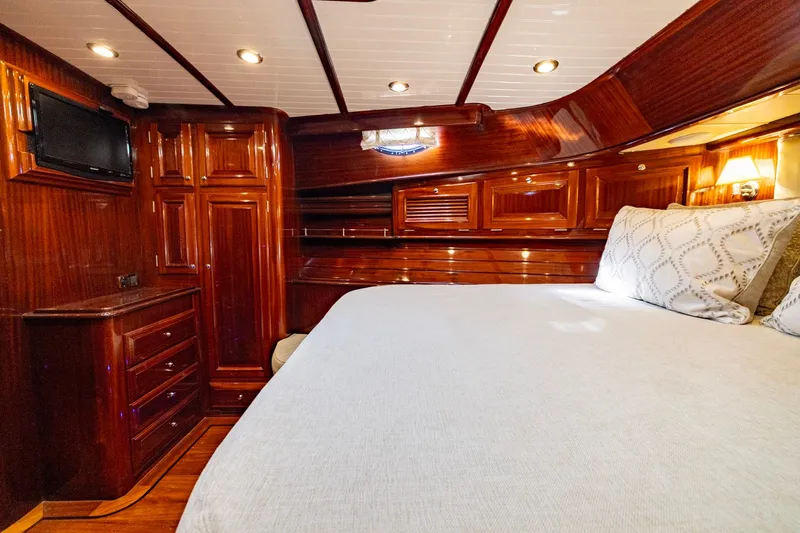 Holly Ann Yacht Photos Pics Luxurious cabin interior of 2010 Vicem 64 Classic yacht with polished wood finish.
