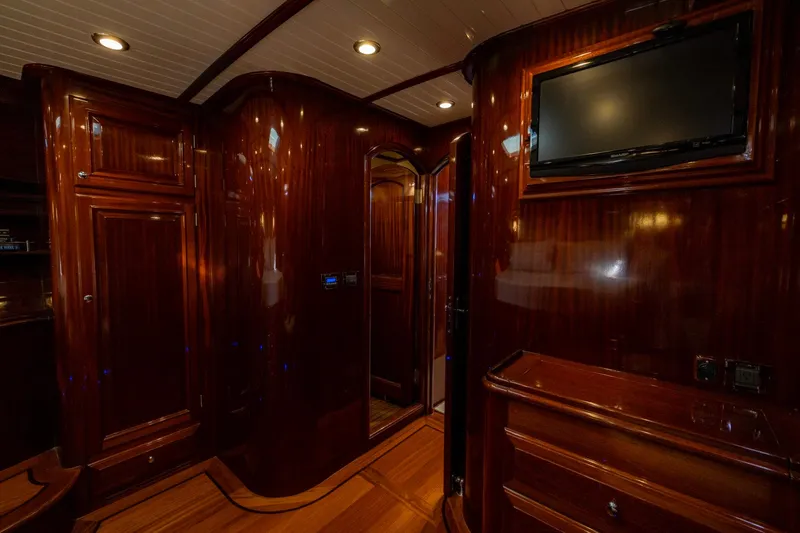 Holly Ann Yacht Photos Pics Luxurious wooden interior of 2010 Vicem 64 Classic yacht with TV and elegant cabinetry.