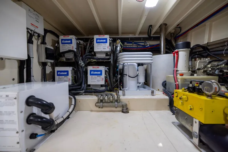 Holly Ann Yacht Photos Pics Engine room of 2010 Vicem 64 Classic yacht with mechanical equipment and wiring.