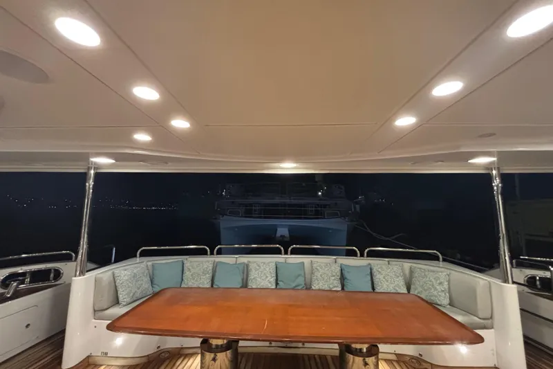  Yacht Photos Pics Luxurious Benetti 121 yacht deck with elegant seating and wooden table, 2015 model.