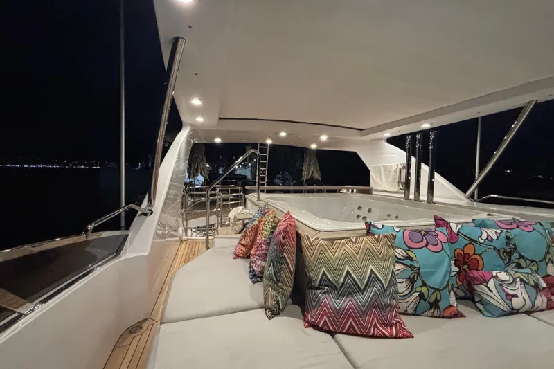  Yacht Photos Pics Luxurious 2015 Benetti 121 yacht deck with colorful cushions and elegant lighting at night.
