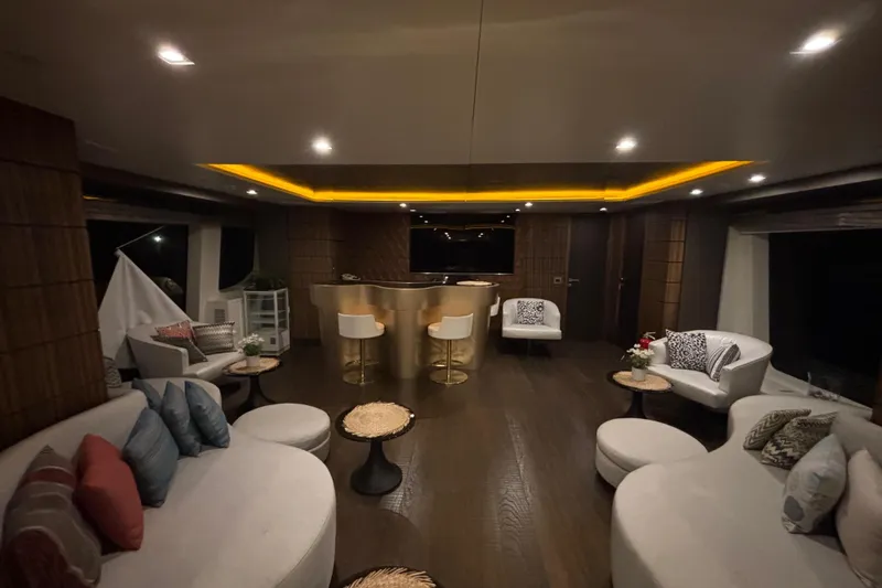  Yacht Photos Pics Luxurious interior of a 2015 Benetti 121 yacht with elegant seating and ambient lighting.