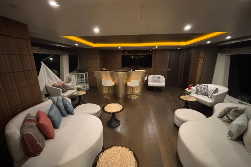  Yacht Photos Pics Luxurious interior of a 2015 Benetti 121 yacht with elegant seating and ambient lighting.