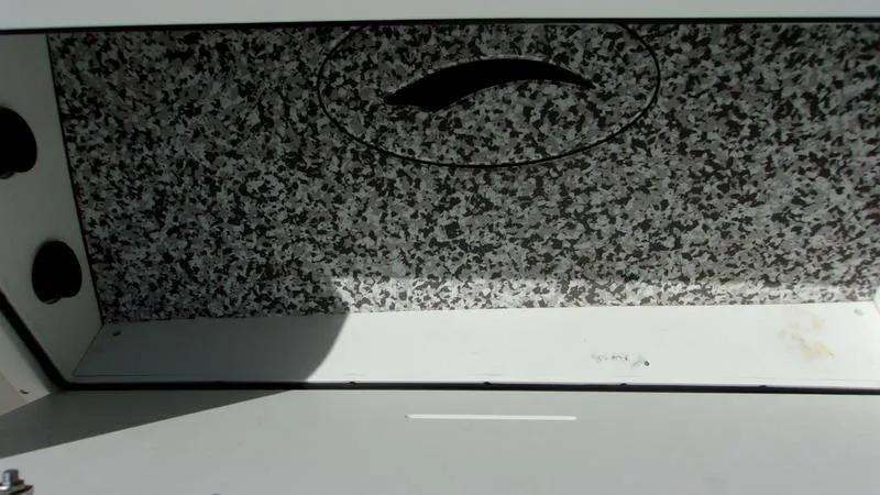  Yacht Photos Pics Interior view of 2022 Crevalle 33 CSF Offshore Fishing boat storage compartment.